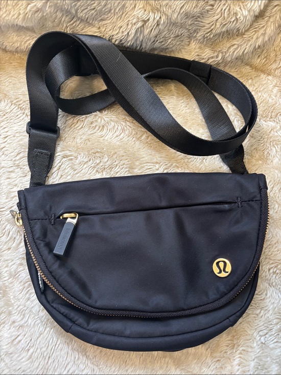 lululemon athletica Handbags - lululemon athletica Black Crossbody Sling with Gold Accents